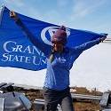 Nicole holding up the GVSU flag.